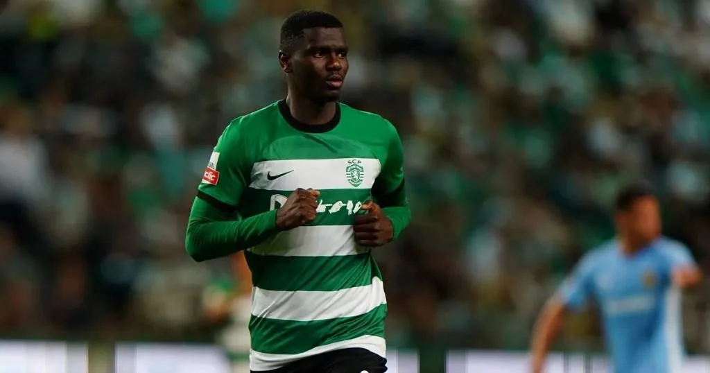 Fabien Diomande, dressed in a green and white uniform, is poised for action on the soccer field